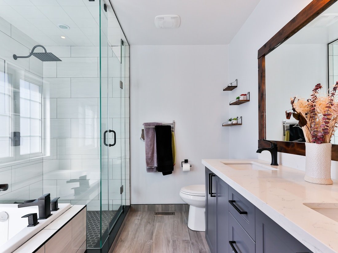 Modern Ottawa bathroom renovation with frameless glass shower and double vanity